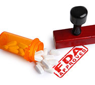Bottle of Pills and a FDA APPROVED rubber stamp