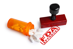 Bottle of Pills and a FDA APPROVED rubber stamp